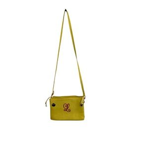 Initials Inc Yellow Crossbody Bag pink L on front. Gold hardware pockets